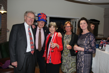 Chris celebrating with Christo and other attendees.